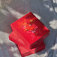 Red gift box with floral decoration