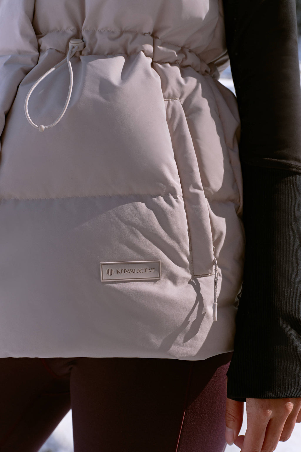 close up of grey down vest