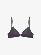 Flat lay of black bra on a light gray background.