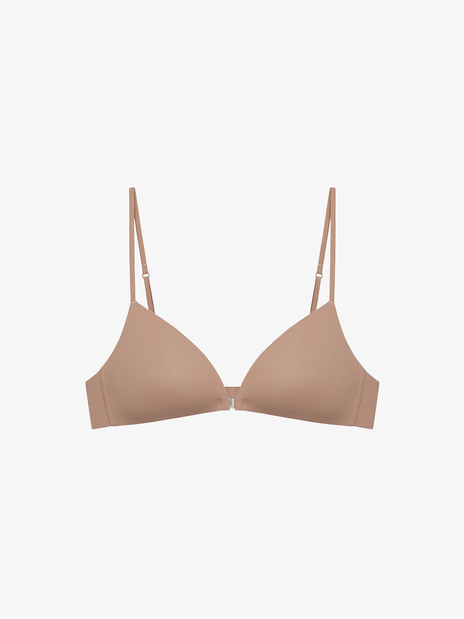 Flat lay of beige bra on a light gray background.