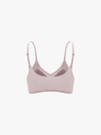 Light pink bra on a white background