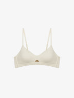 Flat lay of light beige bra. Sticky Rice color. 