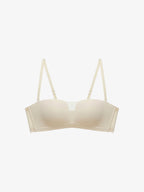 Flat lay of beige strapless bra.