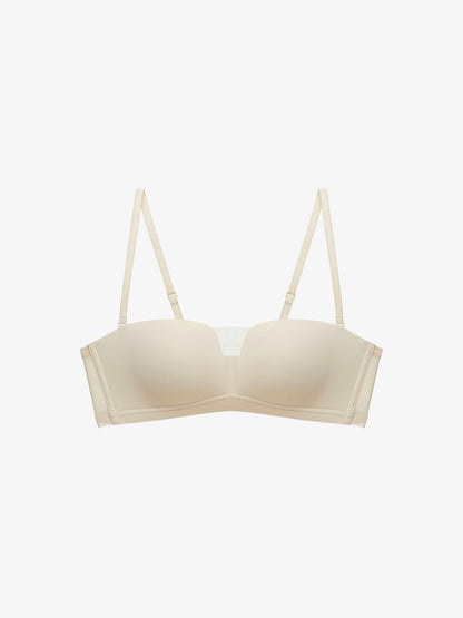 Flat lay of beige strapless bra.