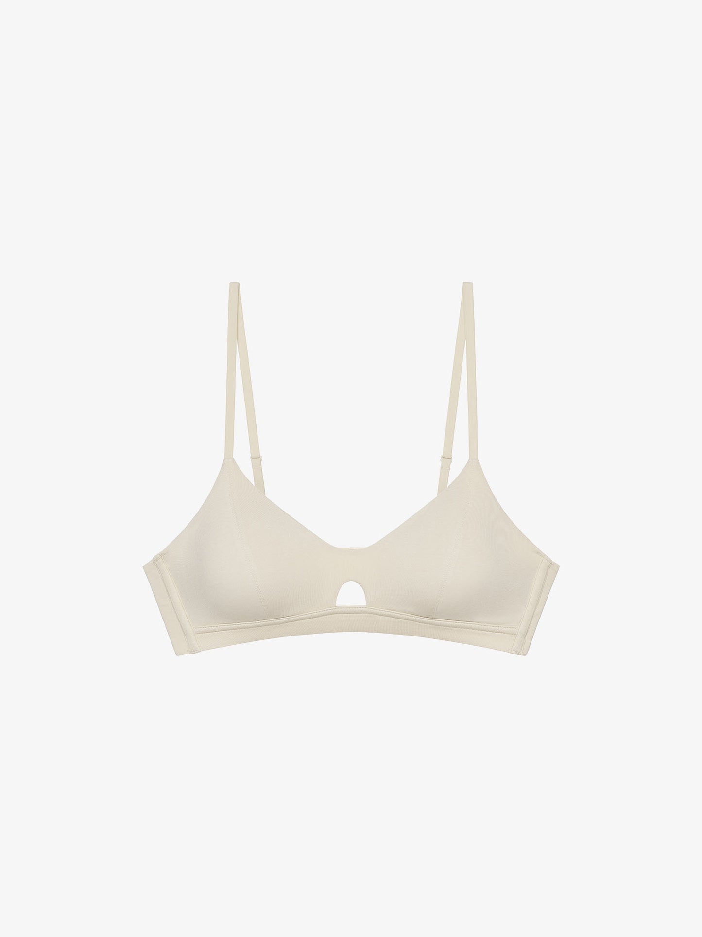 Flat lay of eggshell white bra with keyhole detailing
