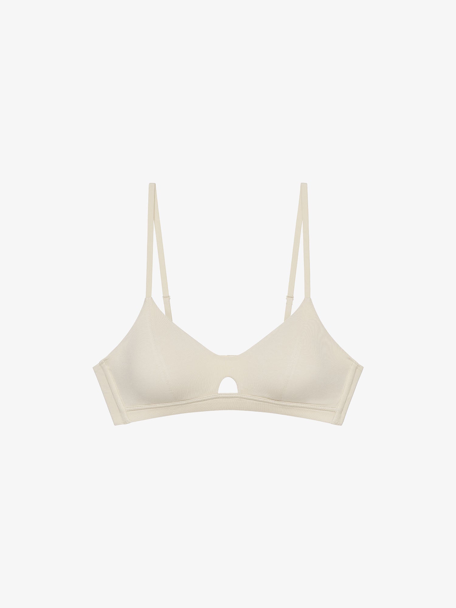 Flat lay of eggshell white bra with keyhole detailing