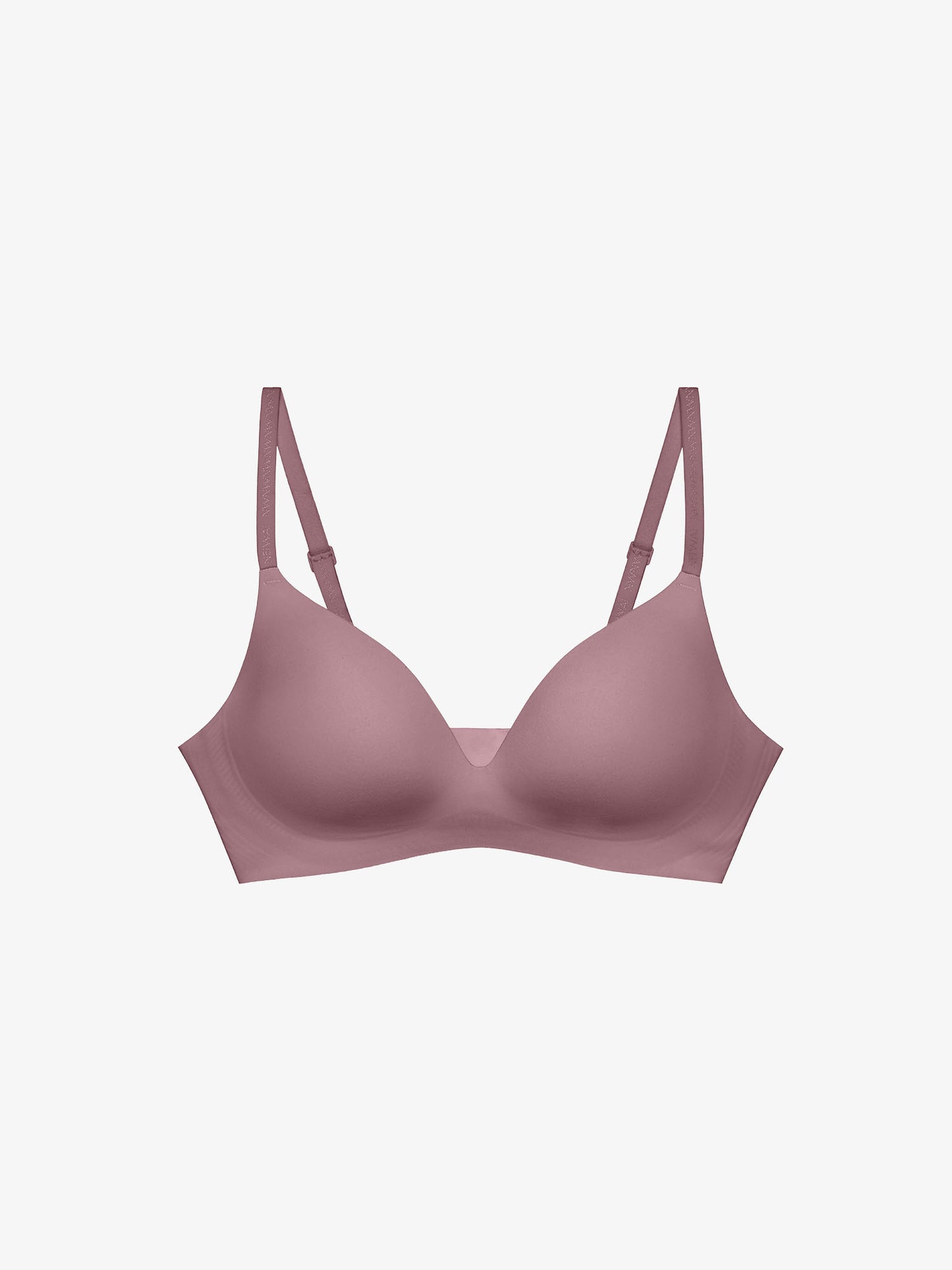 Flat lay of light pink bra. 
