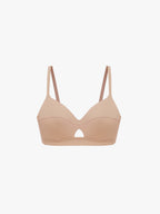 Beige bralette on a white background. Ecru