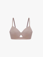 Beige bra on a light beige background. Nude Pink