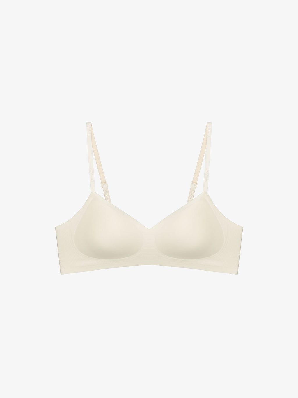 Flat lay of light cream colored bra. Sugar Swizzle color.