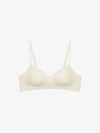 Flat lay of light cream colored bra. Sugar Swizzle color.