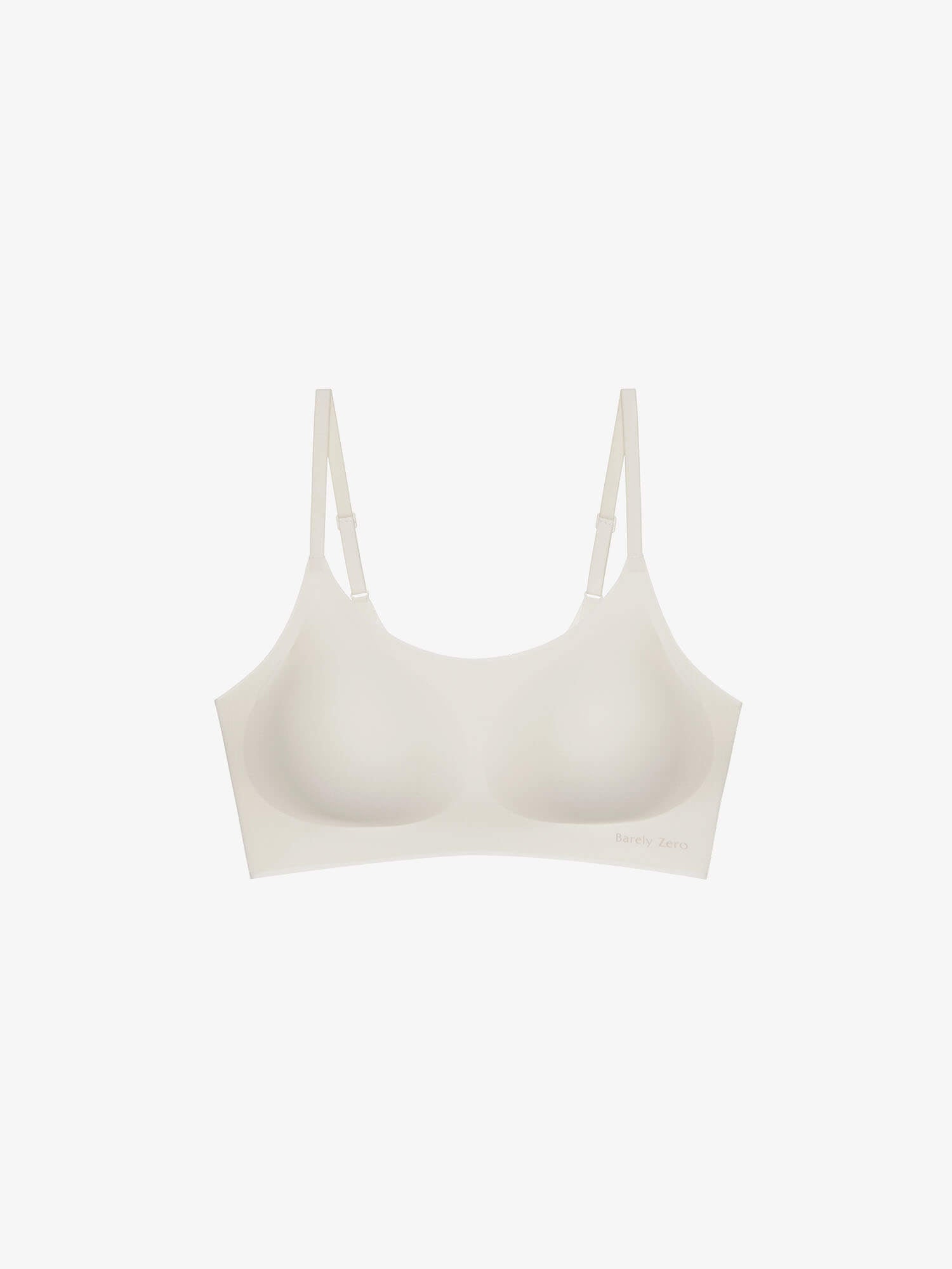 Flat lay of white barely zero bra. Eggwhite color.
