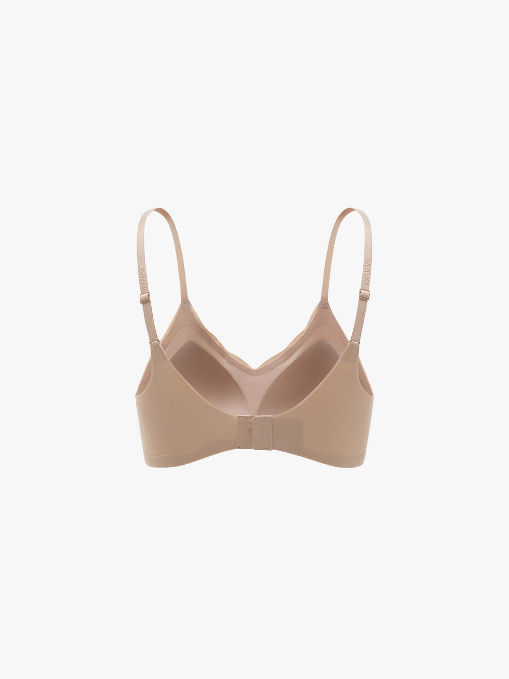 Beige bra on a light beige background. Treacly Almond color.