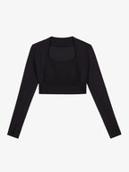 Flat lay of black cropped long sleeve top.