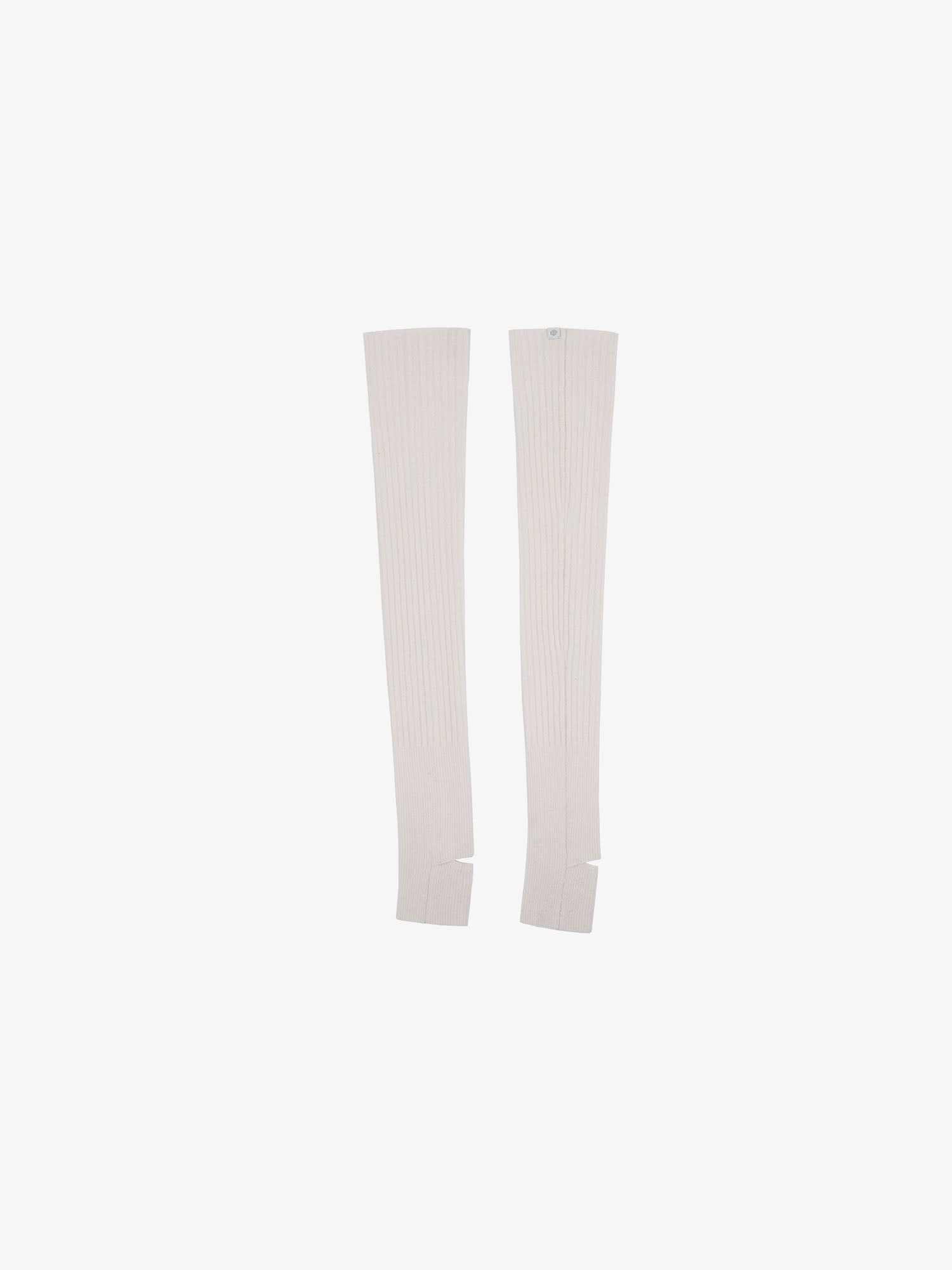 Flat lay of white leg warmers. 