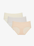 Three pairs of women's briefs in beige, gray, and nude color on a white background