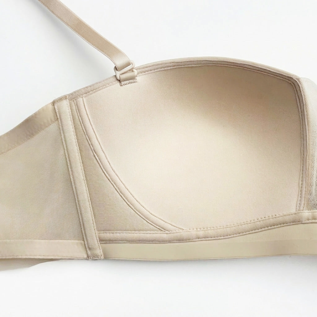 Beige bra on a white background