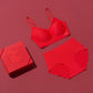 a red bra, a red brief  and a red gift box