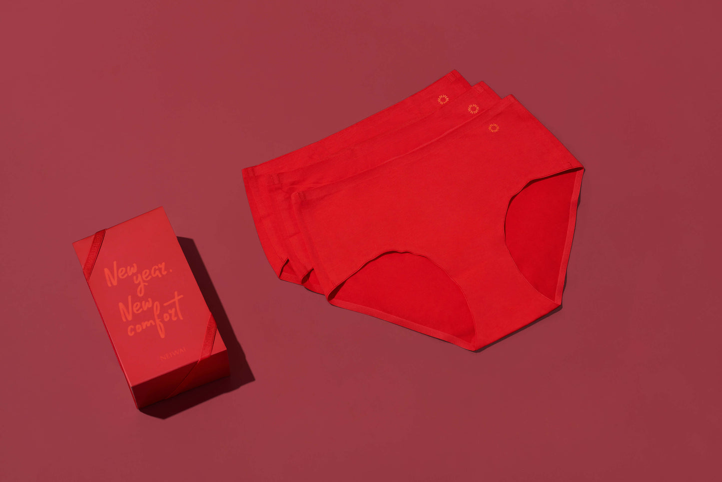 three red briefs and a red gift box