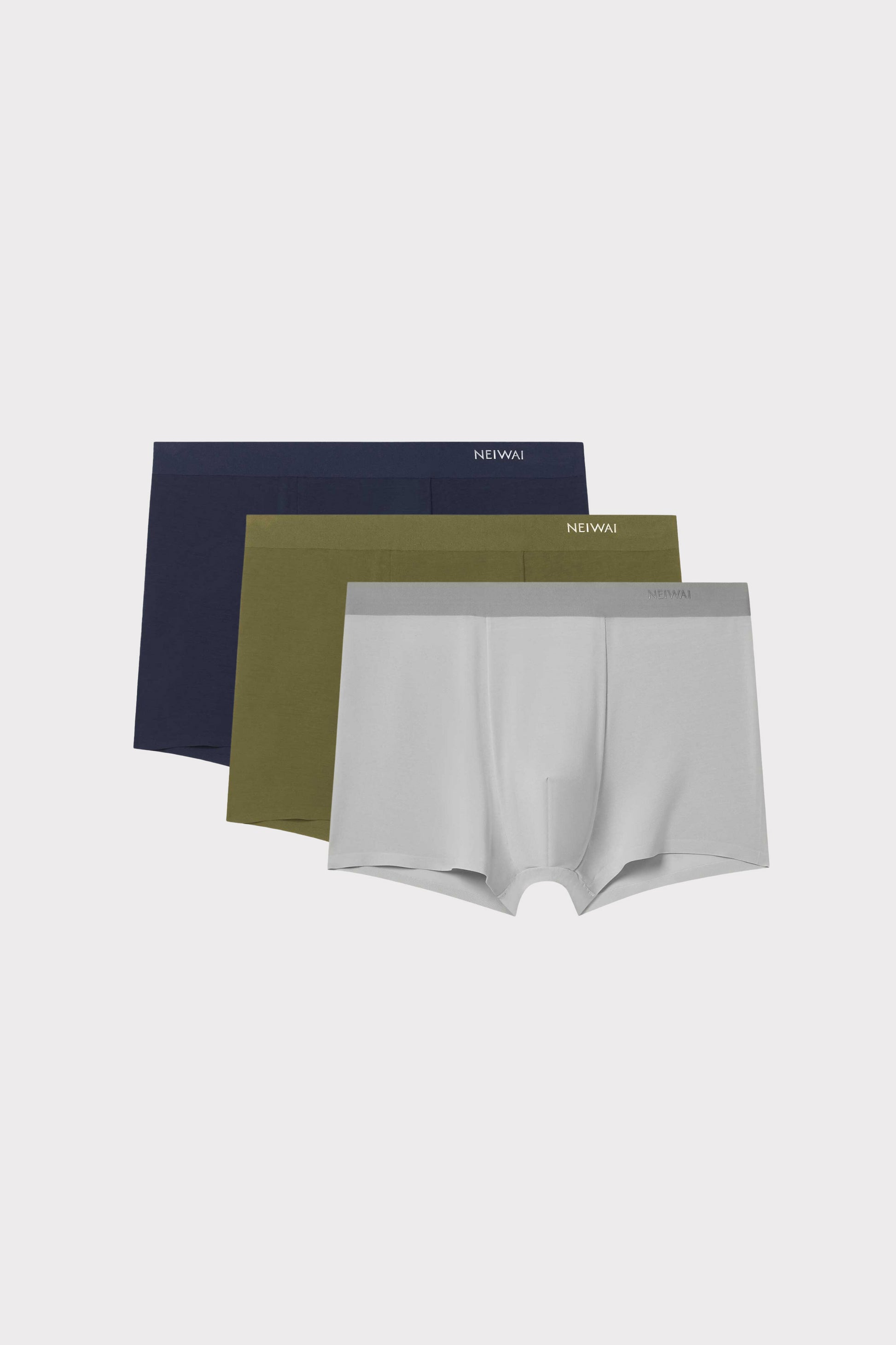 three briefs in navy, green, and grey
