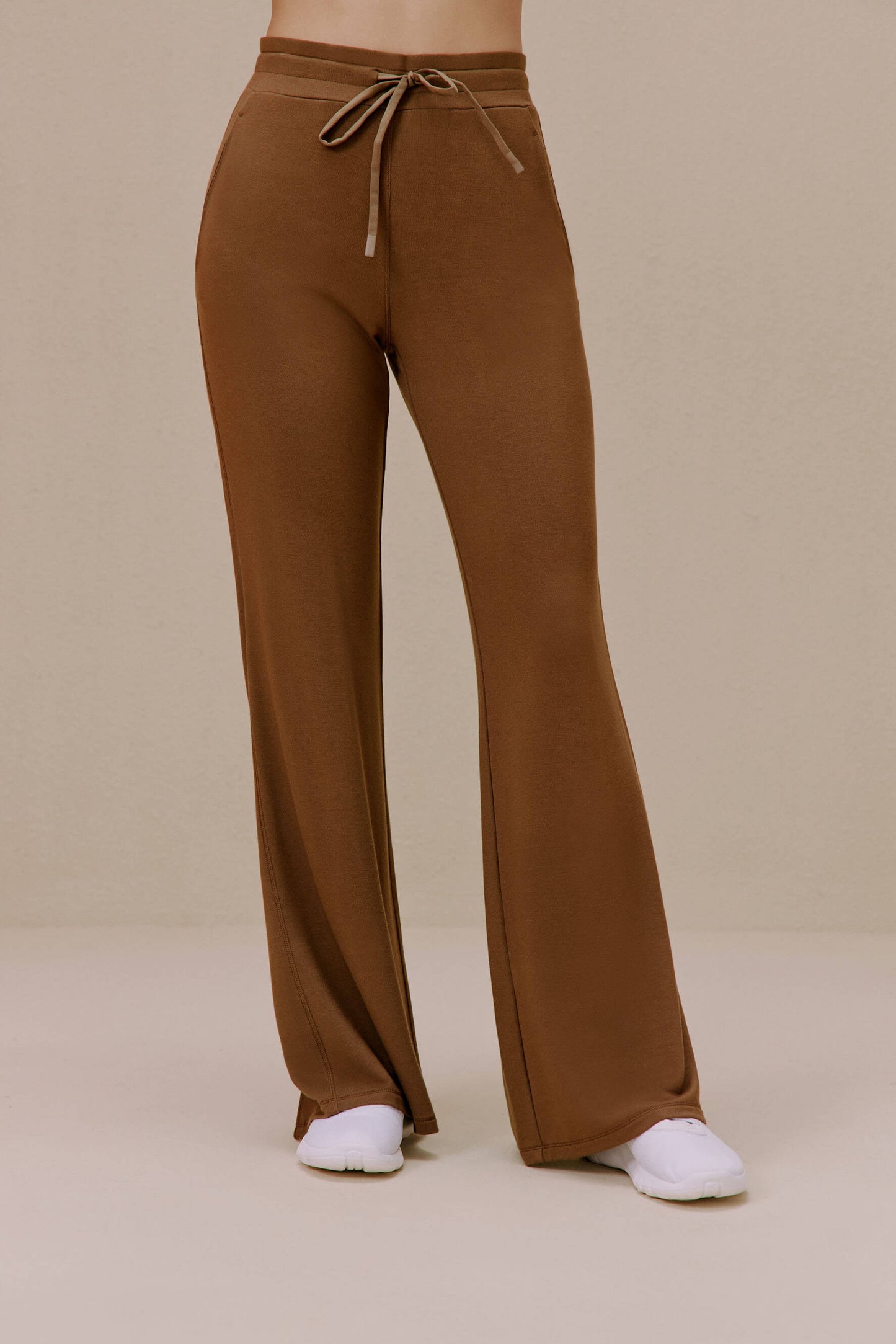 Woman wearing ginger orange pants