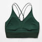 the inside look of the green sports bra, showing the pockets for the removable pads