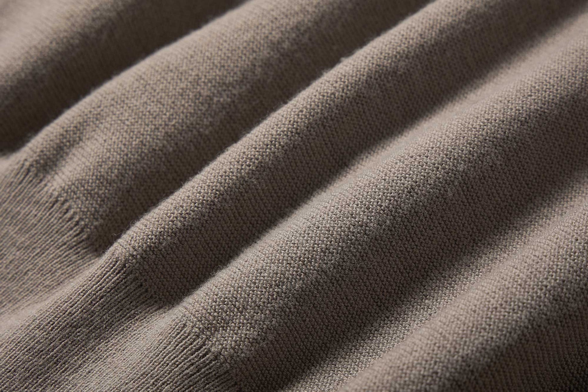 fabric detail of taupe wrap sweater.