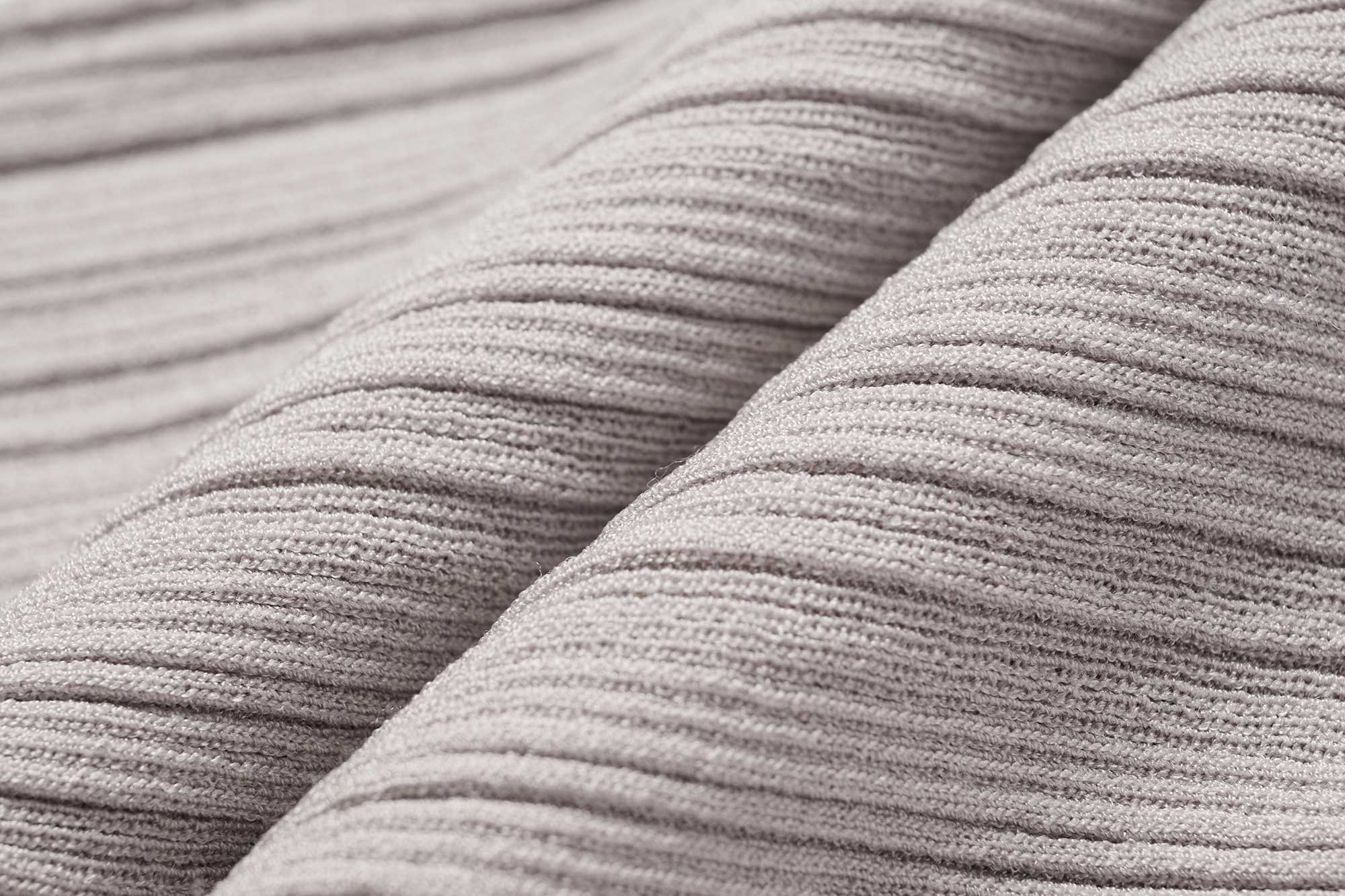fabric detail of light grey shrug