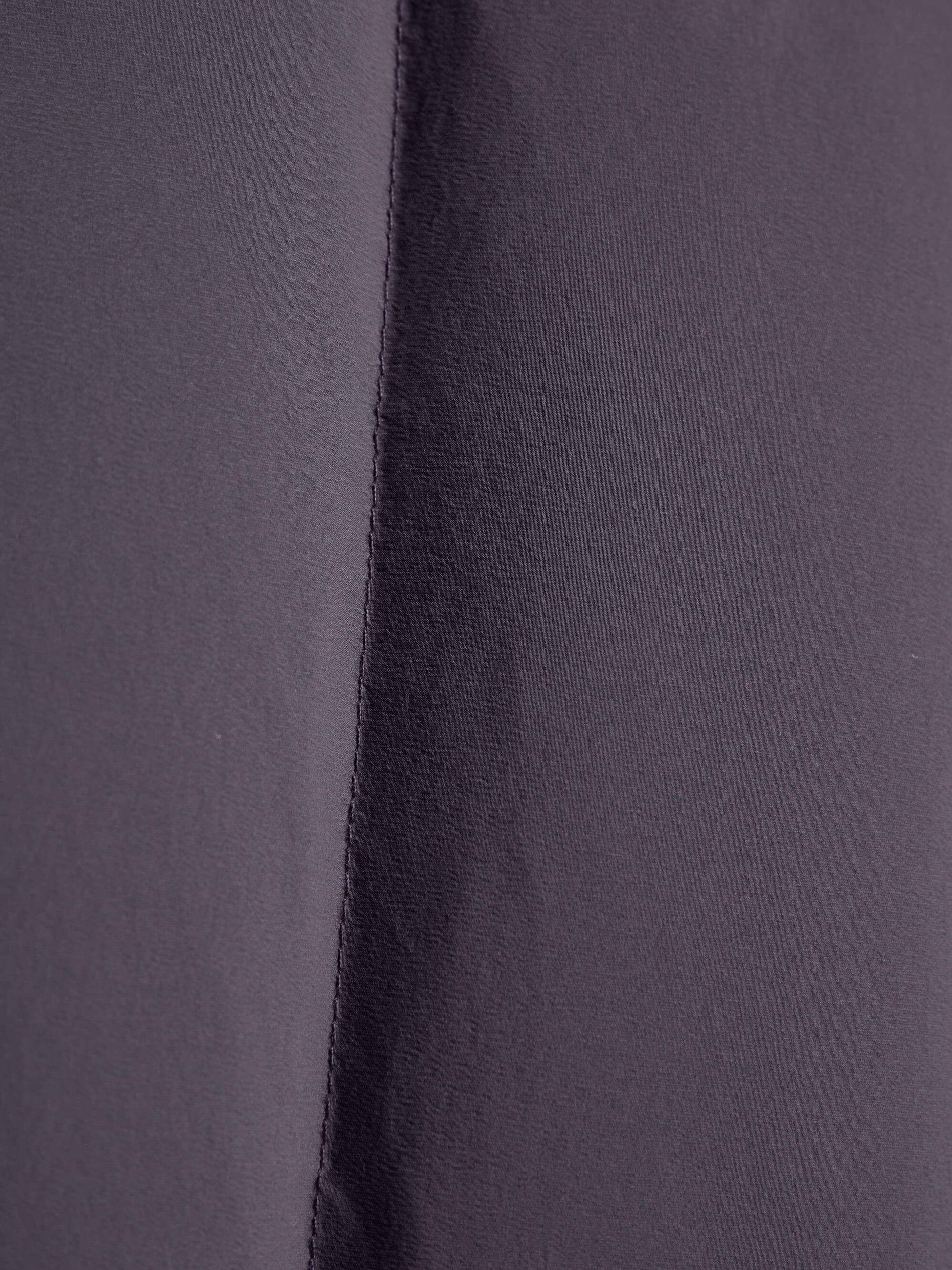 Fabric detail of purple cropped jacket