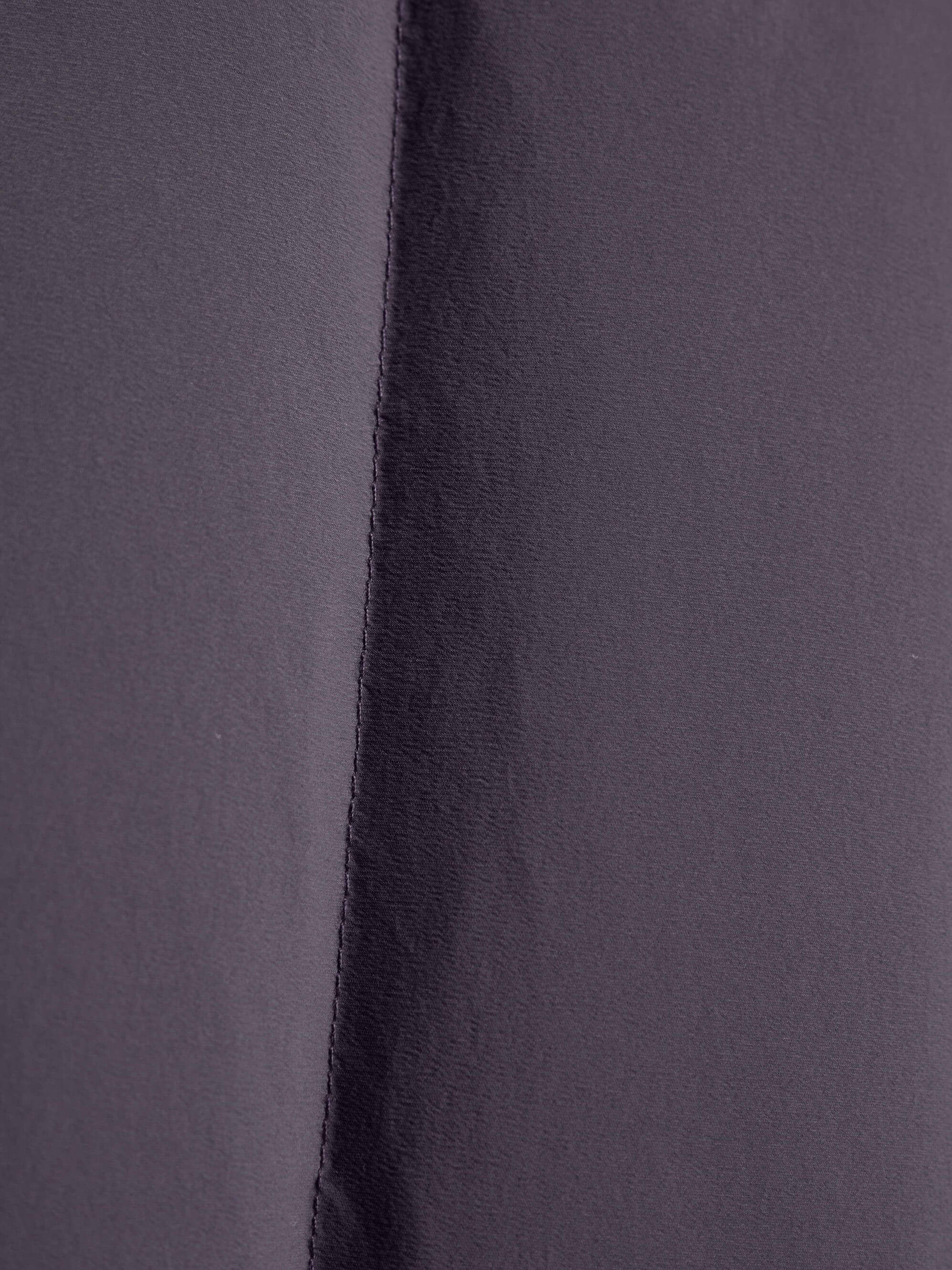 Fabric detail of purple cropped jacket