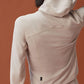 back of woman in beige zipped hooded fleece jacket