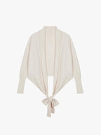 Flat lay image of knotted cream wrap sweater