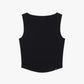 Flat lay of black sleeveless top with a ribbed lower section, displayed flat against a white background.