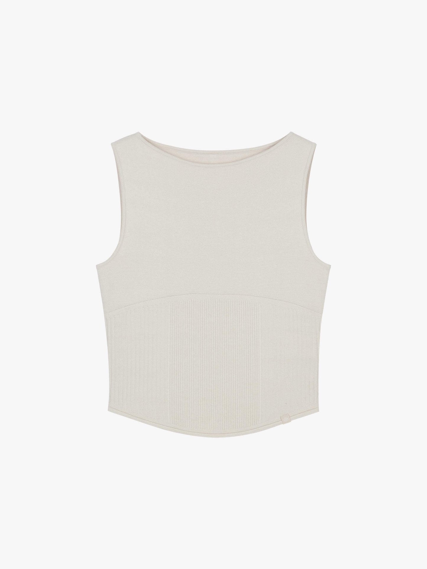 Flat lay of white sleeveless top with a ribbed lower section, displayed flat against a white background.