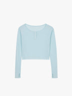 Flat lay of a light blue waffle long sleeve top, displayed flat against a white background.
