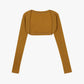 Flat lay of brown ballet wool ribbed shrug displayed against a white background. 