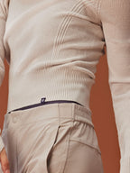 close up of woman in beige knitted hoodie