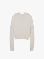flat lay of beige knitted hoodie