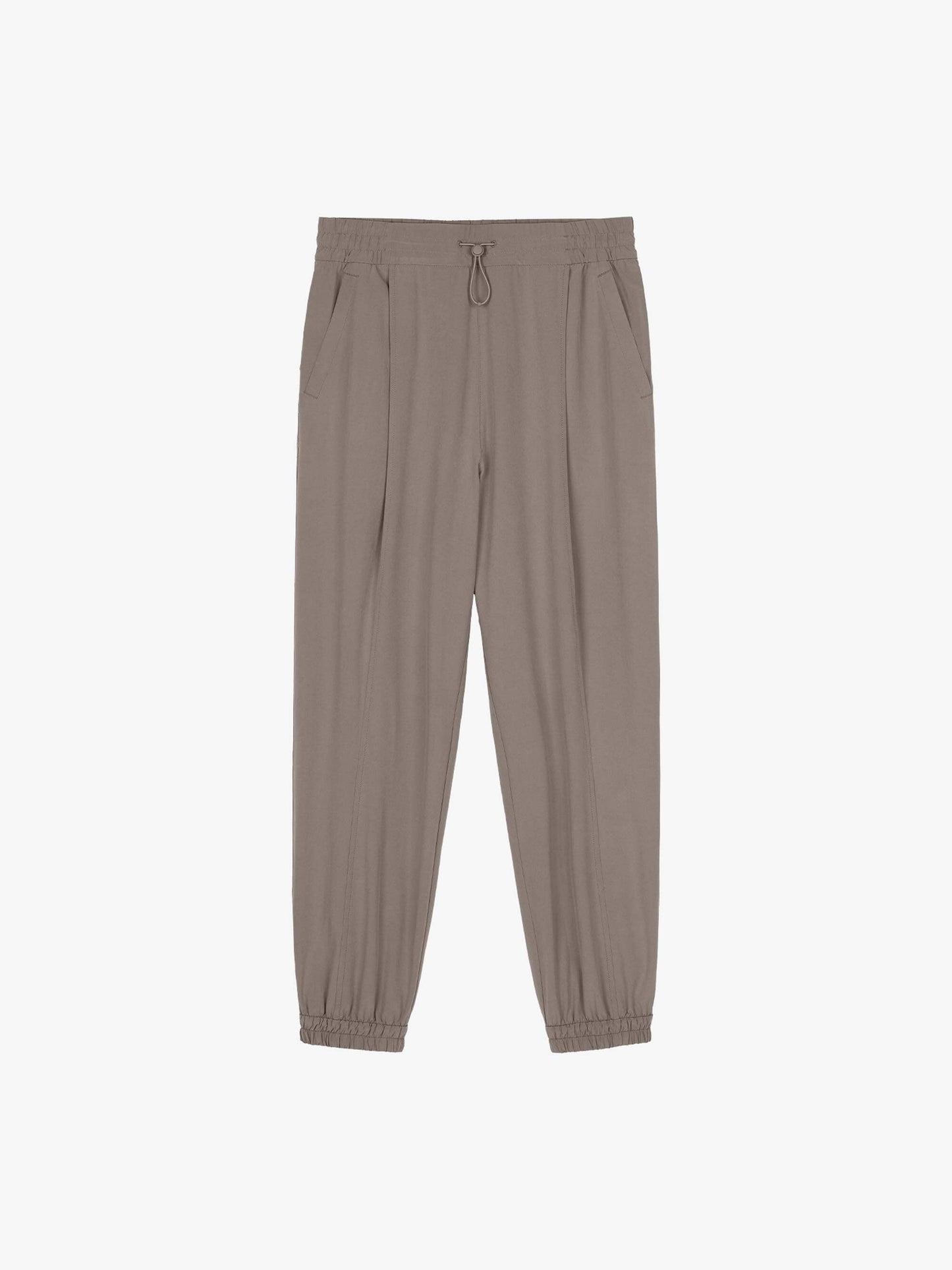 Flat lay of beige light woven pants with an elastic waistband and drawstring, featuring cuffed ankles, displayed flat against a white background