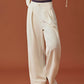 woman in white wide leg pants