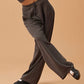 woman in dark gray wide leg pants