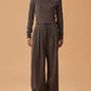 woman in dark gray hoodie and matching wide leg pants