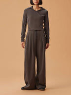 woman in dark gray hoodie and matching wide leg pants