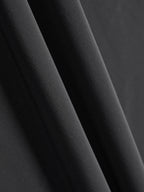 Close-up of black fabric with a smooth, slightly textured surface.
