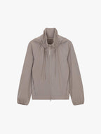 Product image of a taupe hooded jacket with a full front zipper, drawstring details at the neck, and elasticized cuffs.