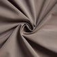 Close-up image of taupe fabric with a soft and smooth texture, twisted to showcase its flexibility and drape.