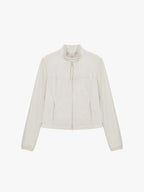 Flat lay of a beige fitted zip-up jacket displayed flat against a white background.