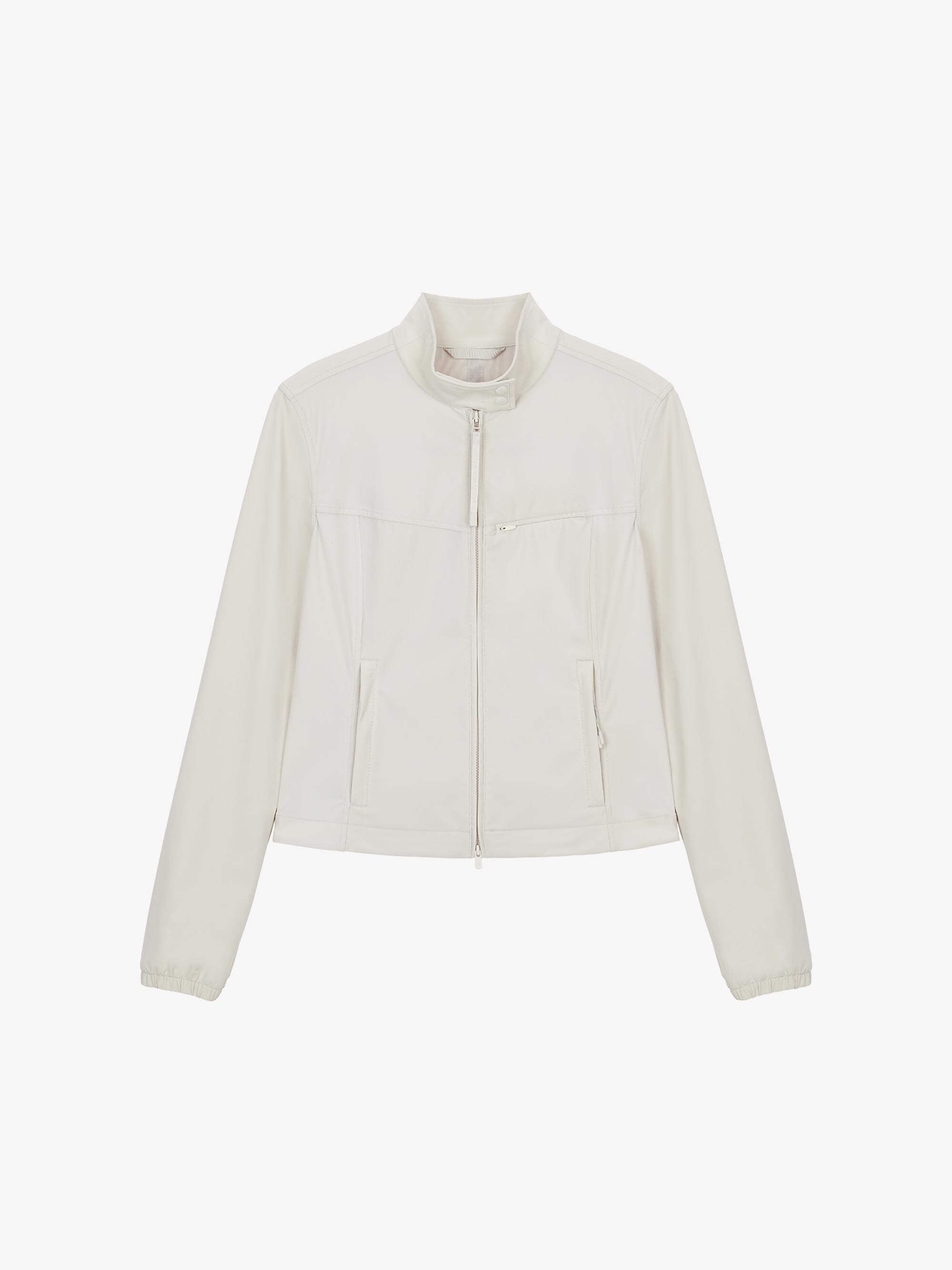 Flat lay of a beige fitted zip-up jacket displayed flat against a white background.