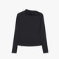 Flat lay of asymmetric long-sleeve top in black.