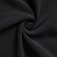 Close-up of black fabric, twisted to show the softness.